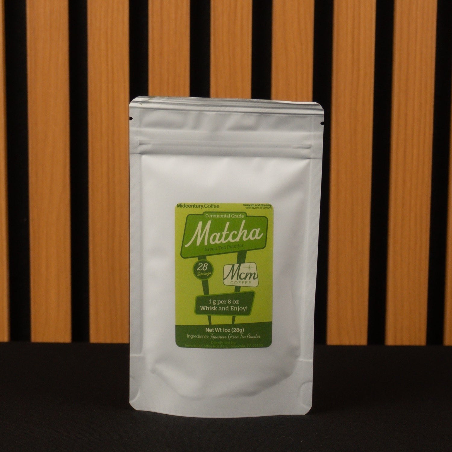 Matcha green tea package with a green label on a wooden background