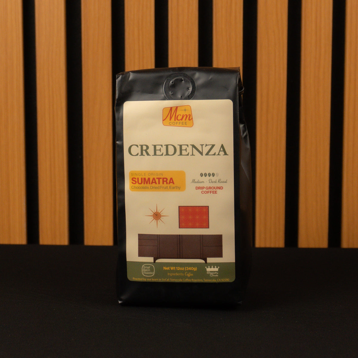 Coffee bag labeled 'Credenza Sumatra' on a wooden background