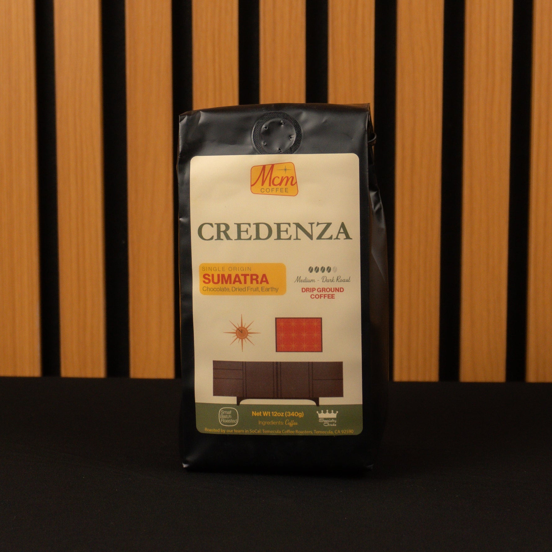 Coffee bag labeled 'Credenza Sumatra' on a wooden background