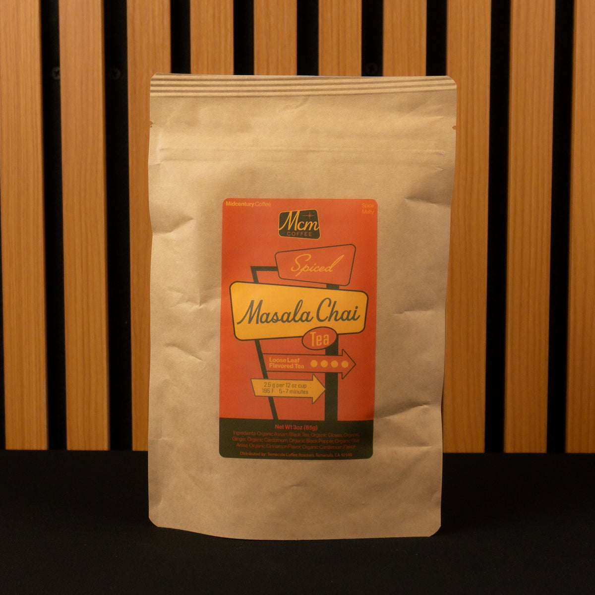 Bag of Masala Chai tea with a label on a wooden slatted background