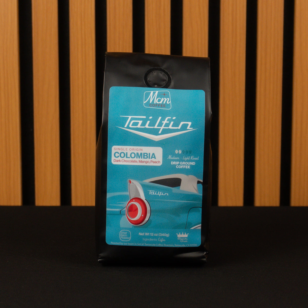 Tailfin Colombia coffee package on a wooden background